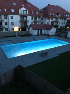 a large swimming pool in front of a building at Middelkerke green garden in Middelkerke +6 photos