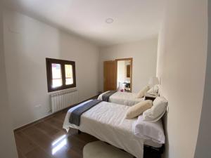 Ένα ή περισσότερα κρεβάτια σε δωμάτιο στο SILBO RURAL