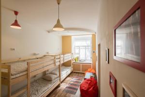 a room with two bunk beds and a window at Pihta in Vyborg