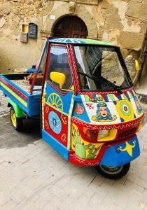 a colorful car parked in front of a building at B&B al centro storico in Troina