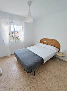 Posteľ alebo postele v izbe v ubytovaní Precioso apartamento en la playa de Bellreguard