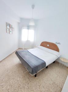 Posteľ alebo postele v izbe v ubytovaní Precioso apartamento en la playa de Bellreguard