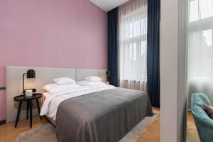 Postel nebo postele na pokoji v ubytování Alice Hotel