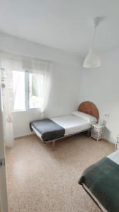 Posteľ alebo postele v izbe v ubytovaní Precioso apartamento en la playa de Bellreguard