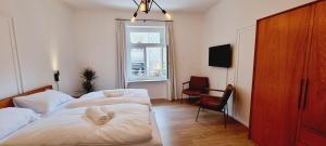 Postel nebo postele na pokoji v ubytování Rosa Rooms Meran