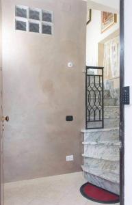 a door leading to a staircase in a house at L'altra casa 1933 in Rionero in Vulture