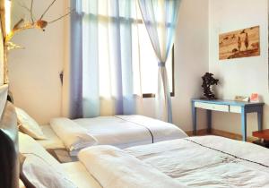 Letto o letti in una camera di Banshan Yard