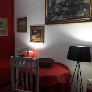 a dining room with a table with a red table cloth at AL-Pinheiro 62 in Porto