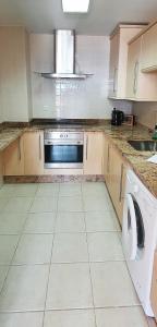 A kitchen or kitchenette at Apartamento Mi casa tu casa