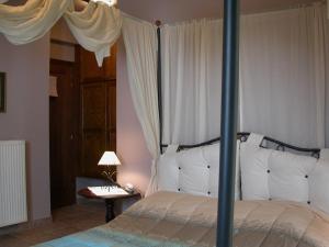 Postel nebo postele na pokoji v ubytování Guesthouse Kalosorisma