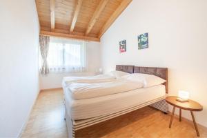 Postel nebo postele na pokoji v ubytování LAAX Homes - Casa Miraval