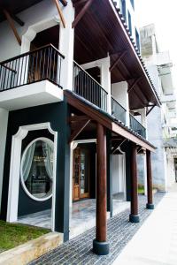 a building with a round mirror on the side of it at The Lantern Hatyai Hotel in Hat Yai