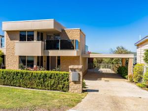 a large brick house with a driveway at Ocean View in San Remo