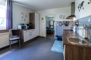 a kitchen with a sink and a counter top at Ferienwohnung zum-vennwack in Monschau