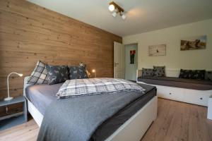 Uma cama ou camas num quarto em AAA Chalet Allegra RoJo with Mountain view