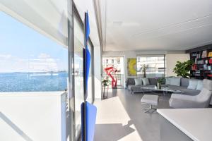 a living room with a view of the ocean at Infinity Sea View Apartment in Thessaloniki