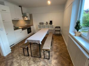 a small kitchen with a table and chairs in it at Group Stay near Bangerpark in Scharnitz