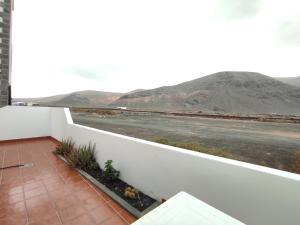 a balcony with a view of the mountains at Mirador del Risco in Órzola
