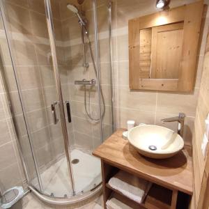 a bathroom with a shower and a sink at Appartement au lac ski aux pieds in Tignes