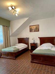 Säng eller sängar i ett rum på Pension Casa Iurca