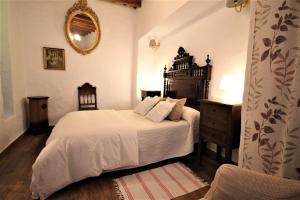 Łóżko lub łóżka w pokoju w obiekcie La Guarida de Vejer Casa Rural