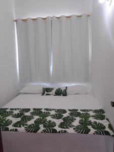 Säng eller sängar i ett rum på Casas Bérgamo