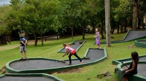 a group of children playing on a trampoline at eBundu Lodge in White River