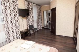 Postel nebo postele na pokoji v ubytování Chyhorinskyi Hotel