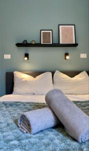 Ένα ή περισσότερα κρεβάτια σε δωμάτιο στο Galilei Apartment