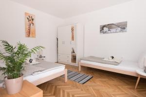 Ένα ή περισσότερα κρεβάτια σε δωμάτιο στο NunaNina apartmani