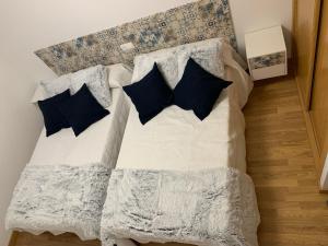 Säng eller sängar i ett rum på Apartamento Porta da Vila