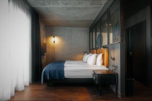Postel nebo postele na pokoji v ubytování Exeter Hotel