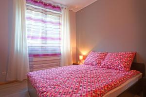Łóżko lub łóżka w pokoju w obiekcie Apartamenty Pod Izbicą