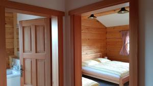 Łóżko lub łóżka w pokoju w obiekcie Apartmány Plešivec