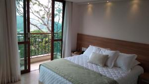 Säng eller sängar i ett rum på Flat Vista Azul Hotel