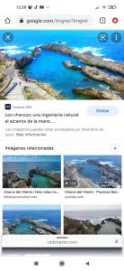 a screenshot of a webpage for a website with a photo of a beach at APARTAMENTO LA CRUCILLADA in La Guancha