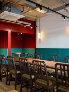 a conference room with a wooden table and chairs at Chic Studios at Chapter Highbury II in London in London