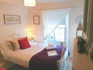 a bedroom with a bed with a tray on it at The Castle House in Richmond