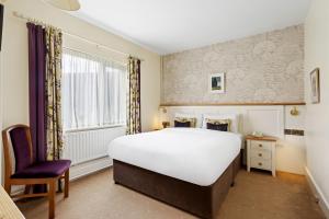 Letto o letti in una camera di Gougane Barra Hotel