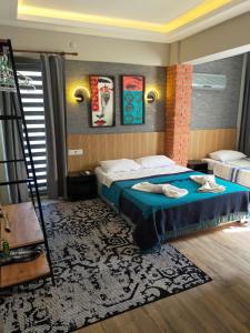 a bedroom with two beds and a ladder in it at Akdeniz apart hotel in Marmaris +73 photos