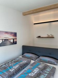 Ένα ή περισσότερα κρεβάτια σε δωμάτιο στο Traumhafter Bergblick im Allgäuer Luftkurort