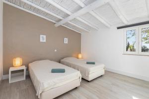 Postel nebo postele na pokoji v ubytování Palmeiras Cottages + 57 fotografií
