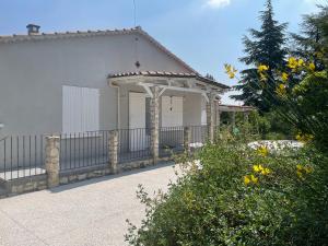 a building with a gazebo and a fence at Villa Camille in Céreste