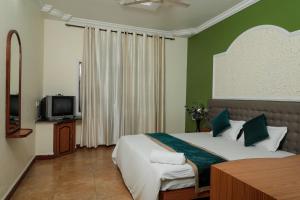 Tempat tidur dalam kamar di Sao Domingos