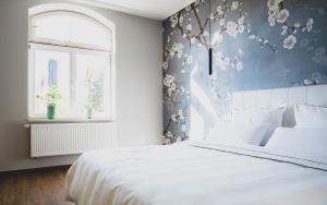 Voodi või voodid majutusasutuse The Kepos Hotel Erlangen toas