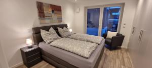 a living room with a couch and a chair at Upland View in Willingen