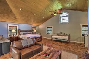a living room with two beds and a couch at Game Room, Theater and Deck Burnsville Cabin! in Burnsville
