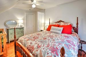 a bedroom with a bed and a ceiling fan at Bright Clear Lake Getaway, 4 Blocks to Downtown! in Clear Lake
