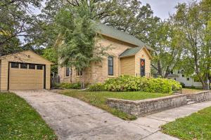 a brick house with a garage and a driveway at Bright Clear Lake Getaway, 4 Blocks to Downtown! in Clear Lake
