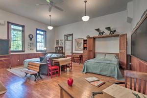 a bedroom with a bed and a desk and a classroom at Renovated WV Schoolhouse History Buffs Heaven! in Kearneysville